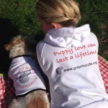 Chandra and Mason with their Grey Muzzle shirts