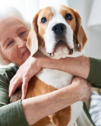 Woman Hugging Dog