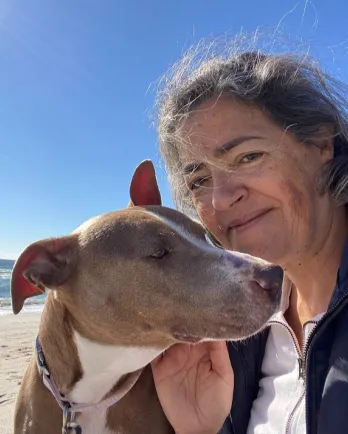 Dog and woman at beach