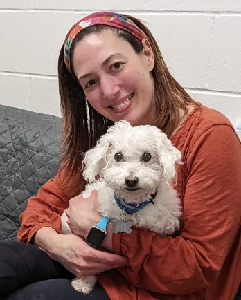 bichon frise with human