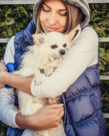 Woman Hugging Dog